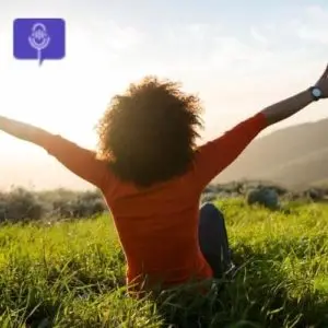 Black woman with outstretched hands in nature