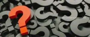 red question mark on top of a pile of black question marks