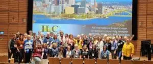 Large group of advocates in front of stage